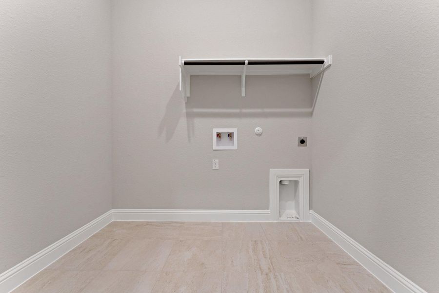 Laundry room featuring gas dryer hookup, hookup for an electric dryer, and washer hookup Laundry room featuring gas dryer hookup, hookup for an electric dryer, and washer hookup