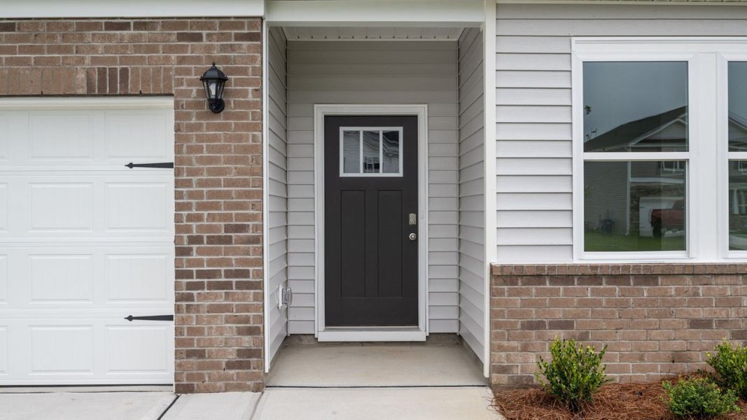 Front exterior of a new home in East Ridge, Ayden, NC, highlighting curb appeal (Image 16).