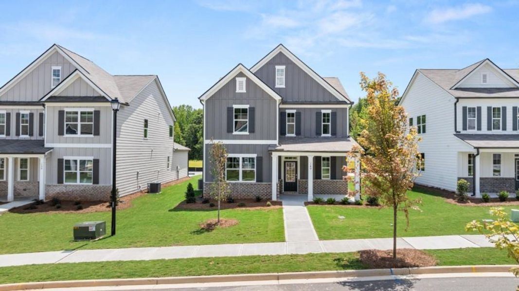 Front exterior of a new home in Braselton Village, Braselton, GA, highlighting curb appeal (Image 15). Front exterior of a new home in Braselton Village, Braselton, GA, highlighting curb appeal (Image 15).