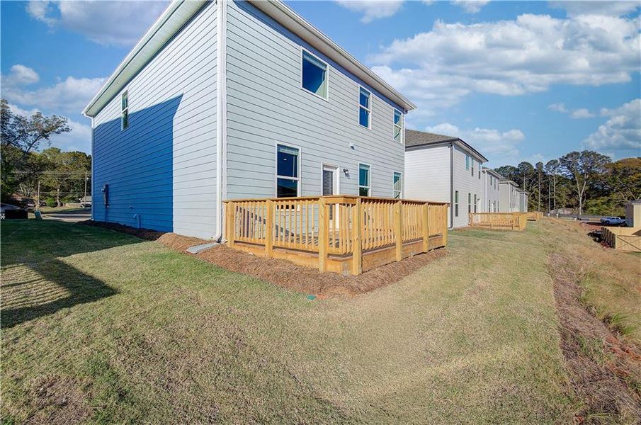 Exterior details and patio area of a home in Enclave at Evergreen, Fairburn (Image 4).