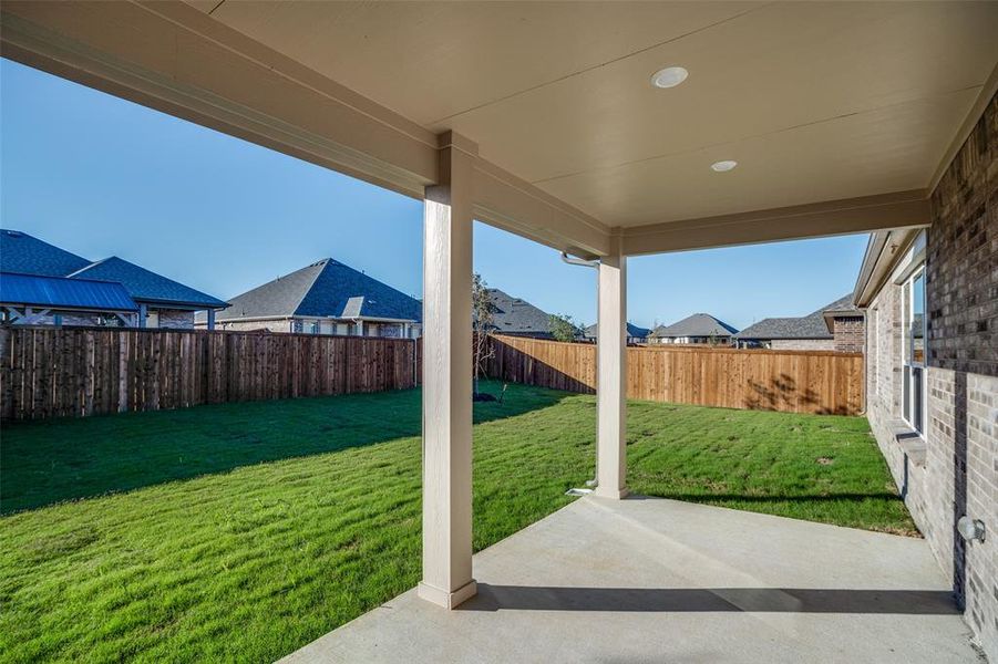 Exterior details and patio area of a home in The Preserve Estates, Justin (Image 4).