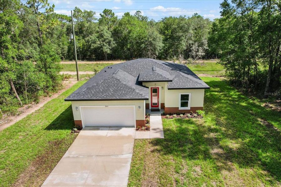 Front exterior of a new home in , Citrus Springs, FL, highlighting curb appeal (Image 20). Front exterior of a new home in , Citrus Springs, FL, highlighting curb appeal (Image 20).