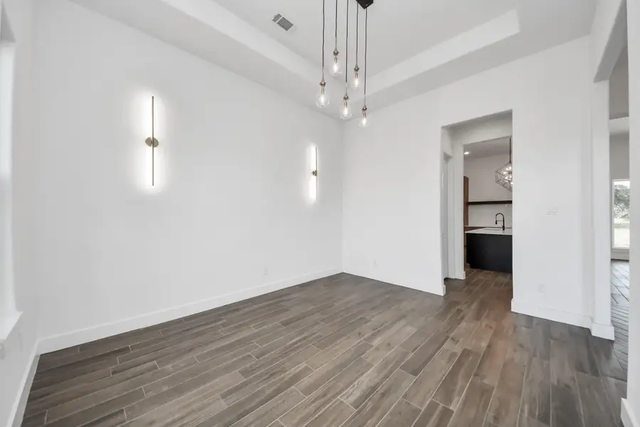 Formal dining room with architectural ceiling detail
