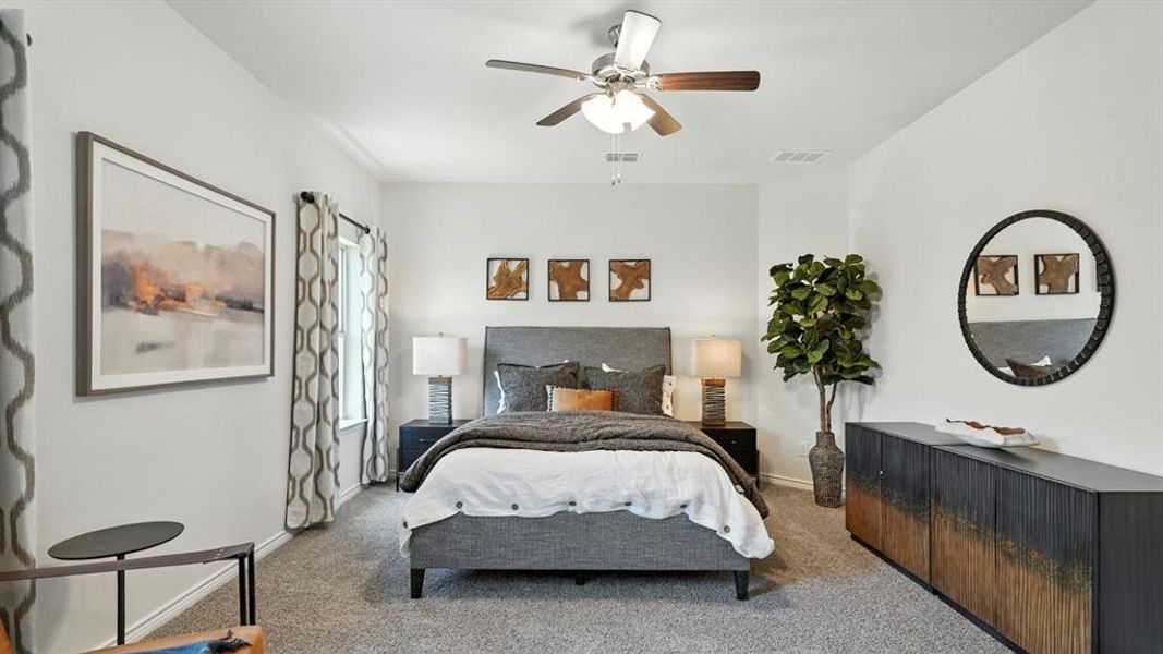 Bedroom with carpet flooring and a ceiling fan