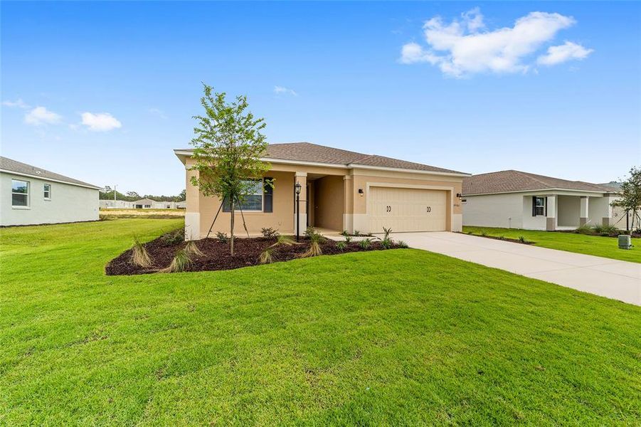 Front exterior of a new home in On Top of the World Communities, Ocala, FL, highlighting curb appeal (Image 22).