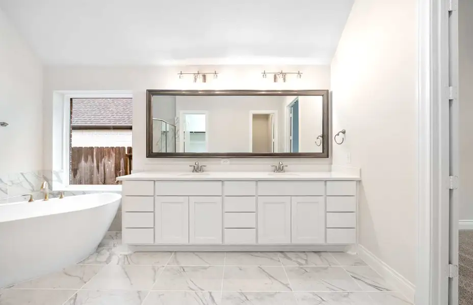 Representative furnished interior of a home built from the 3068 by Ravenna Homes in The Woodlands Hills 65′, Willis (Image 13).