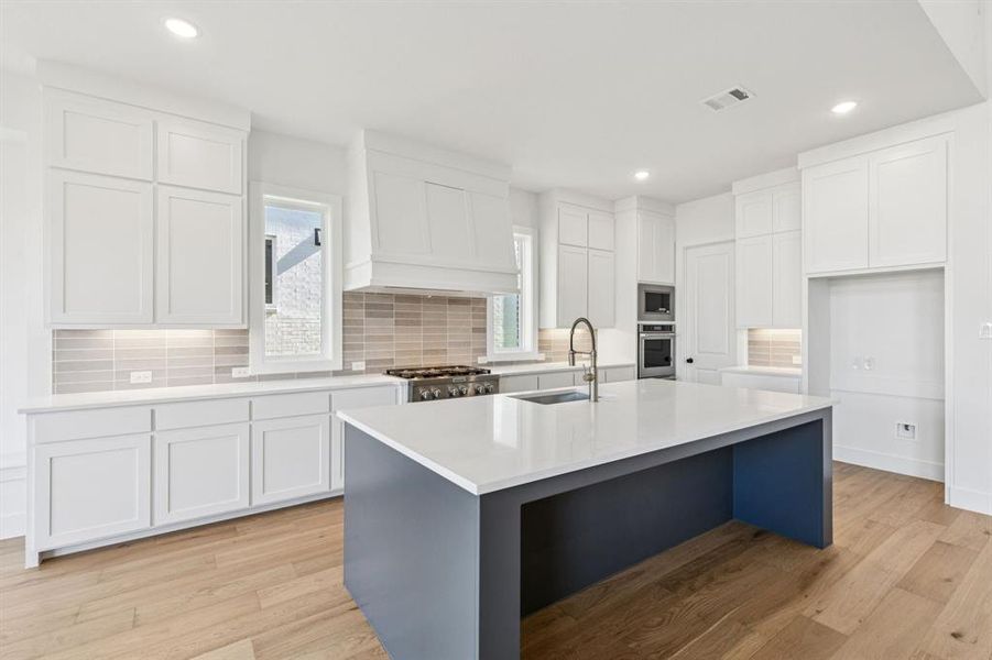 Featuring outstanding storage and prep space, your inner chef will love this over the top kitchen!