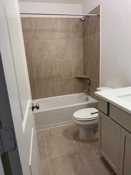 Secondary bathroom features modern finishes and convenient tub shower combination. Secondary bathroom features modern finishes and convenient tub shower combination.