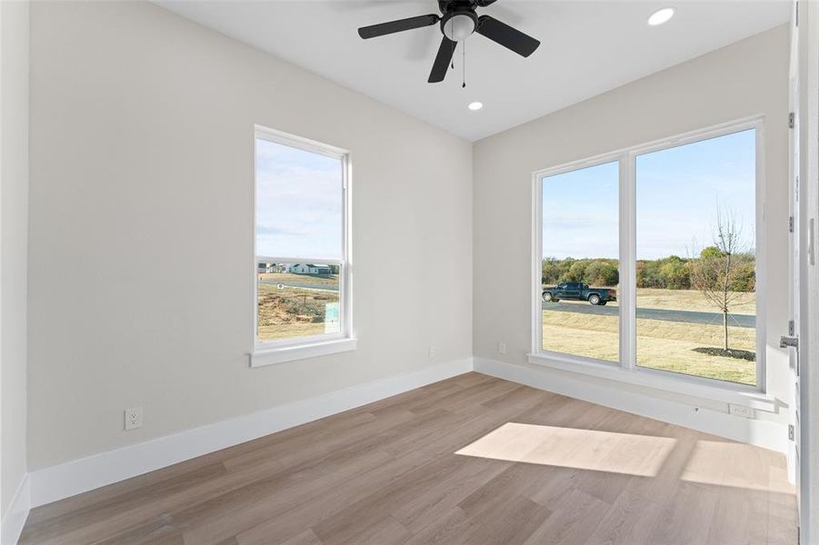Spare room featuring light wood finished floors, recessed lighting, and ceiling fan Spare room featuring light wood finished floors, recessed lighting, and ceiling fan