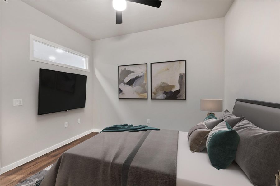 Bedroom featuring dark wood-style floors, baseboards, and a ceiling fan