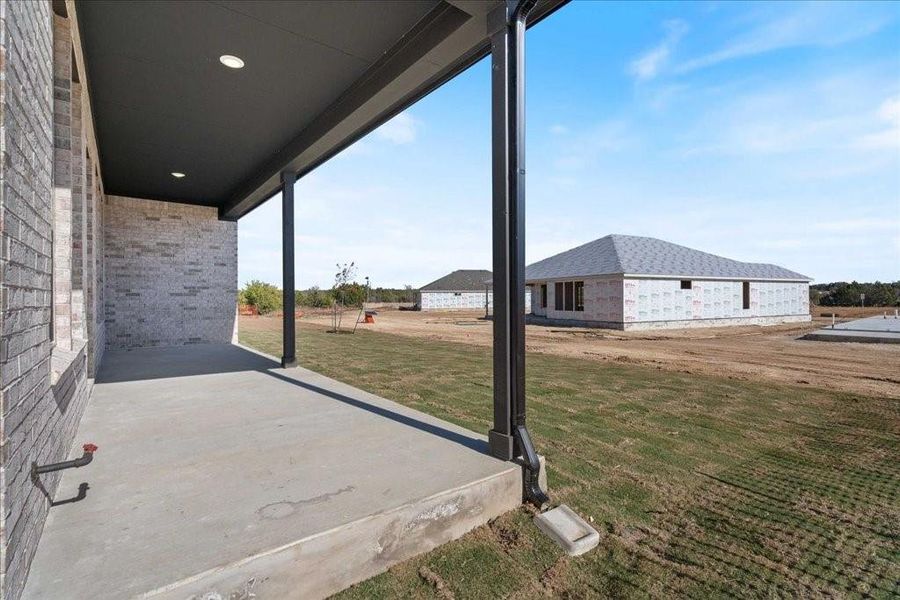 A Texas sunset can easily be enjoyed on this large and inviting back patio!