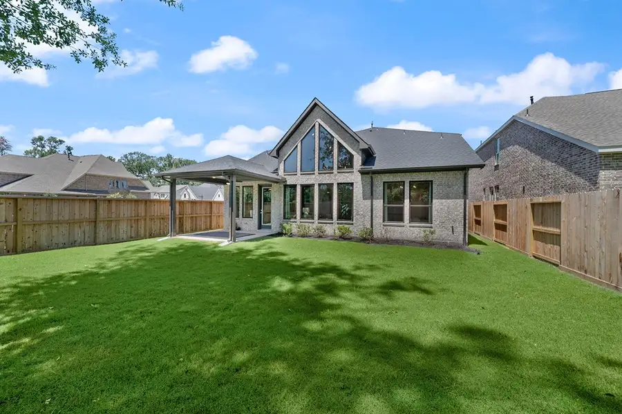 Exterior details and patio area of a home in The Highlands 50', Porter (Image 24).