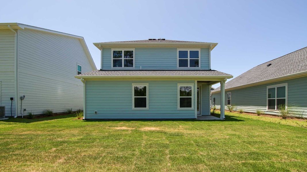 Front exterior of a new home in Breakfast Point East Phase I, Panama City Beach, FL, highlighting curb appeal (Image 20).