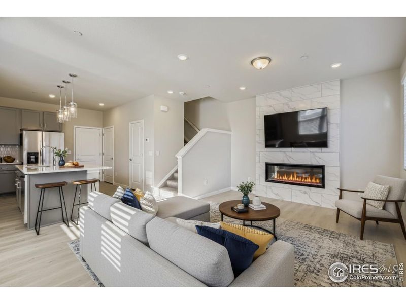 Spacious great room centered by gas fireplace