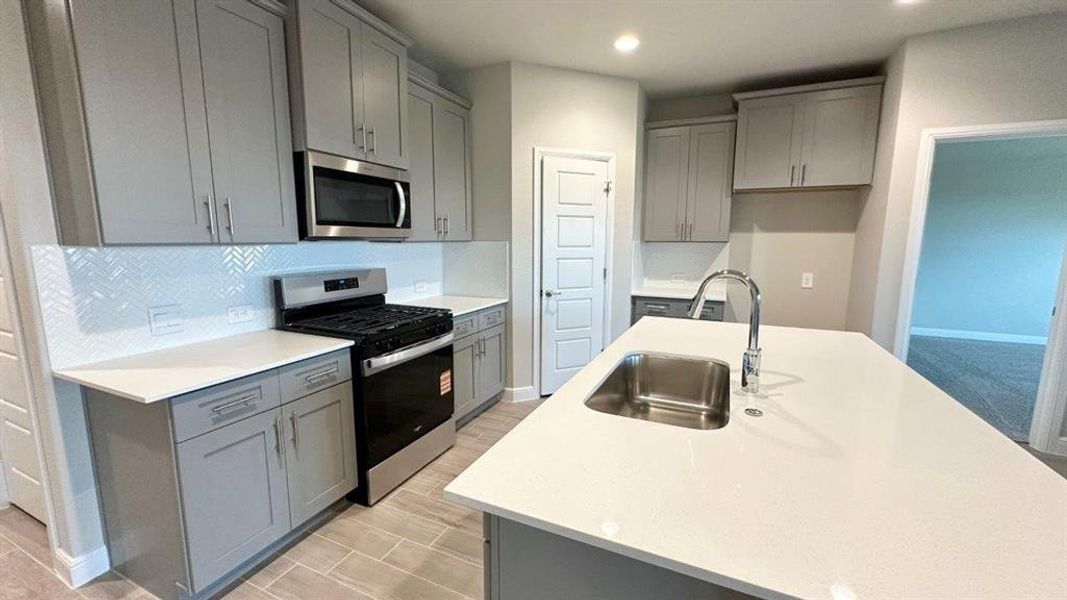 Kitchen - All Home and community information, including pricing, included features, terms, availability and amenities, are subject to change at any time without notice or obligation. All Drawings, pictures, photographs, video, square footages, floor plans, elevations, features, colors and sizes are approximate for illustration purposes only and will vary from the homes as built.