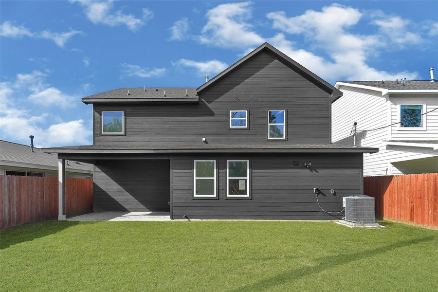 Private backyard with fresh sod and room to relax or play.