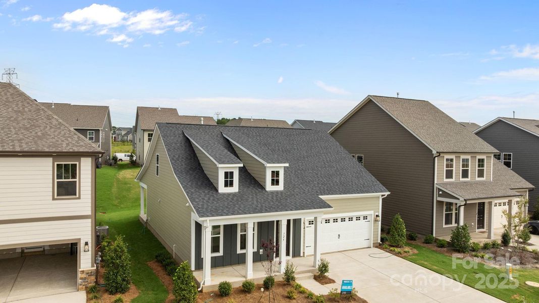 Front exterior of a new home in Lakeside Glen, York, SC, highlighting curb appeal (Image 2). Front exterior of a new home in Lakeside Glen, York, SC, highlighting curb appeal (Image 2).