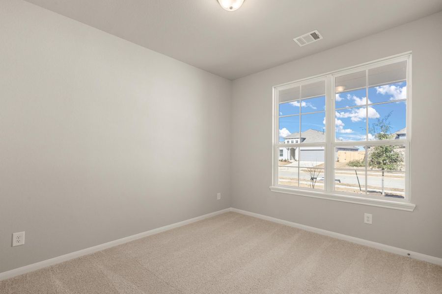 Secondary bedroom. Note: Sample product photo - actual exterior and interior selections may vary by homesite