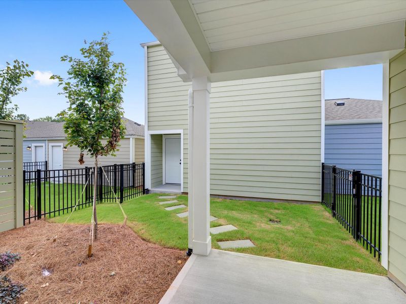 Exterior details and patio area of a home in North Creek Village - Townhomes, Huntersville (Image 4).