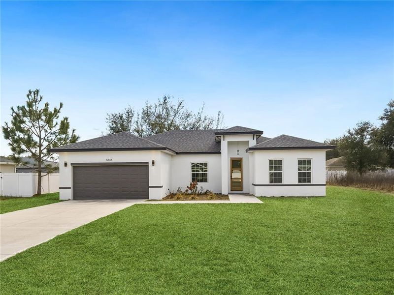 Front exterior of a new home in , Ocala, FL, highlighting curb appeal (Image 19).