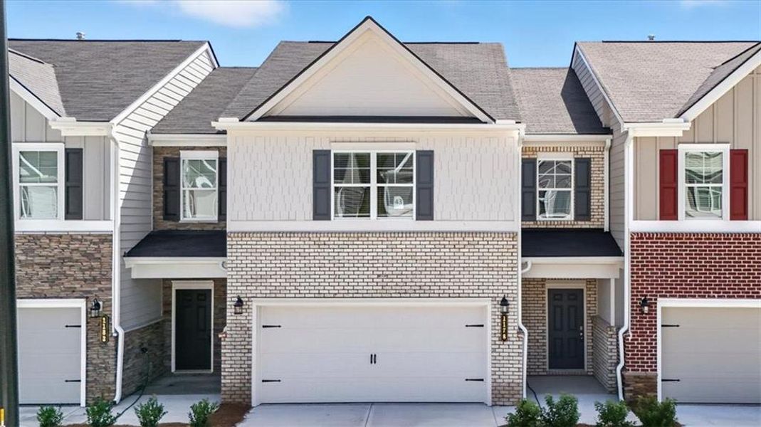 Front exterior of a new home in Park Center Pointe, Austell, GA, highlighting curb appeal (Image 2).