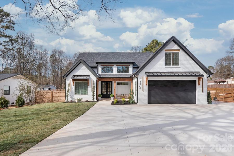 Front exterior of a new home in , Waxhaw, NC, highlighting curb appeal (Image 22). Front exterior of a new home in , Waxhaw, NC, highlighting curb appeal (Image 22).