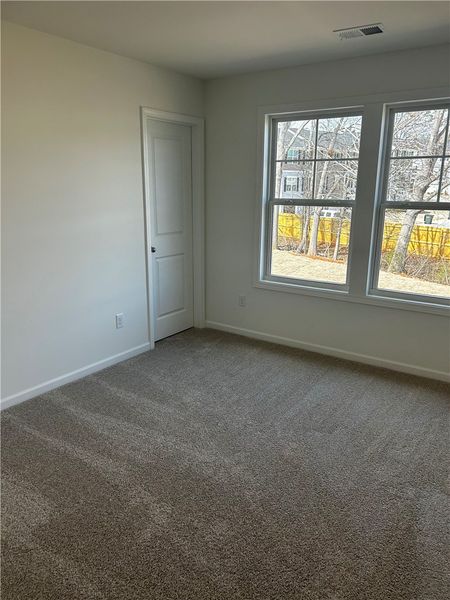 This cozy room offers abundant natural light and a