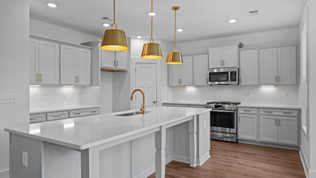 Notable 10-foot island provides generous prep and gathering space in this thoughtfully designed kitchen