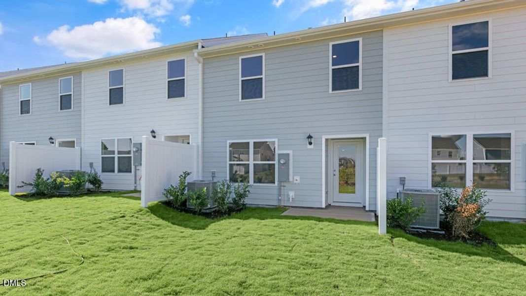 Exterior details and patio area of a home in The Townes at Ridgewood Farms, Winterville (Image 28).