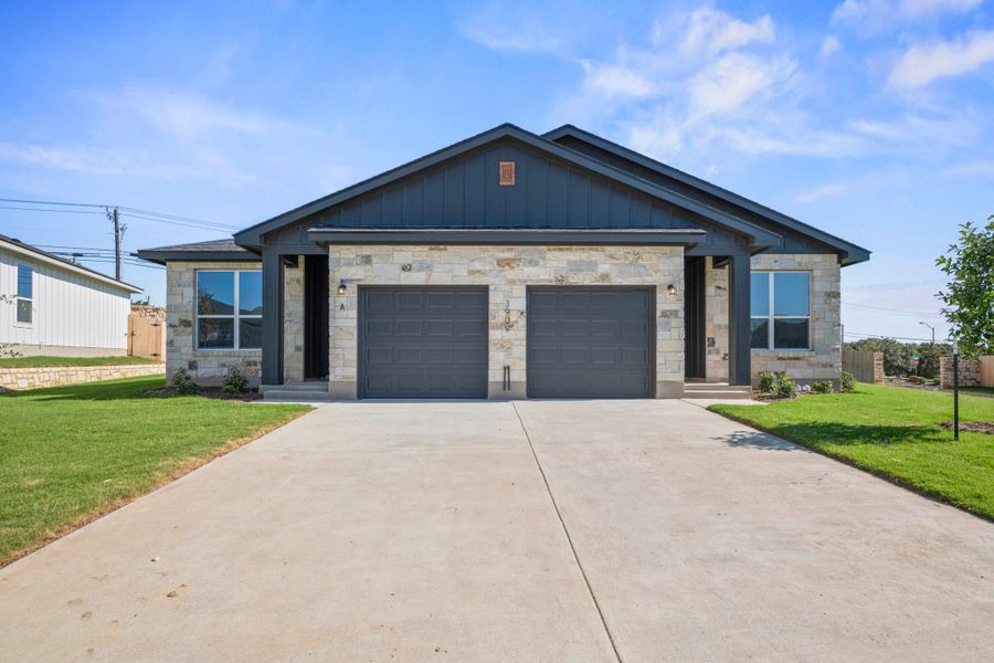 Front exterior of a new home in The Preserve at Thousand Oaks Duplexes, Killeen, TX, highlighting curb appeal (Image 1). Front exterior of a new home in The Preserve at Thousand Oaks Duplexes, Killeen, TX, highlighting curb appeal (Image 1).