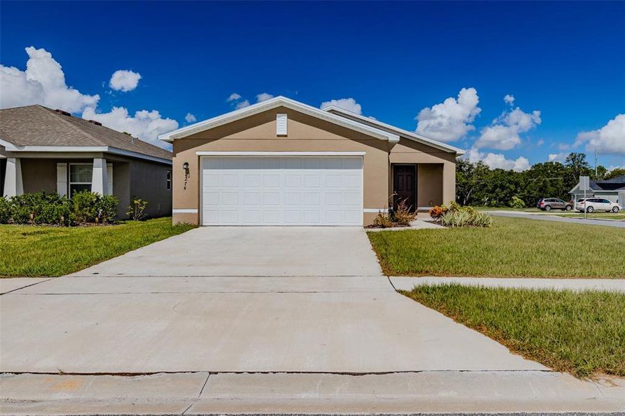 Front exterior of a new home in , Eagle Lake, FL, highlighting curb appeal (Image 23).