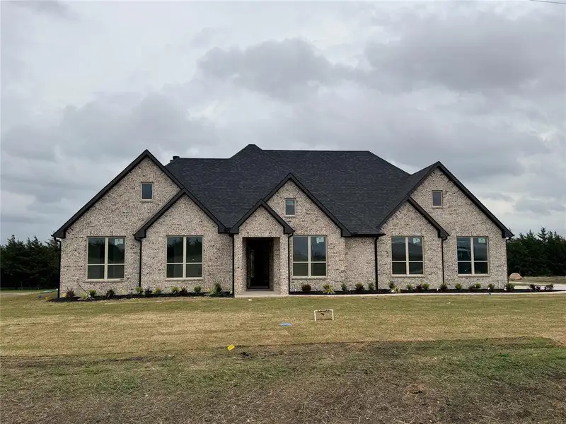 Front exterior of a new home in , Celeste, TX, highlighting curb appeal (Image 3).