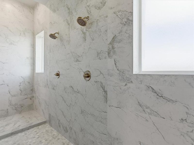 Bathroom with a marble finish shower and plenty of natural light
