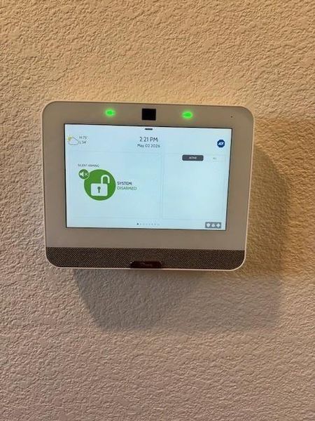 Integrated smart home security panel with full-color display and textured wall finish