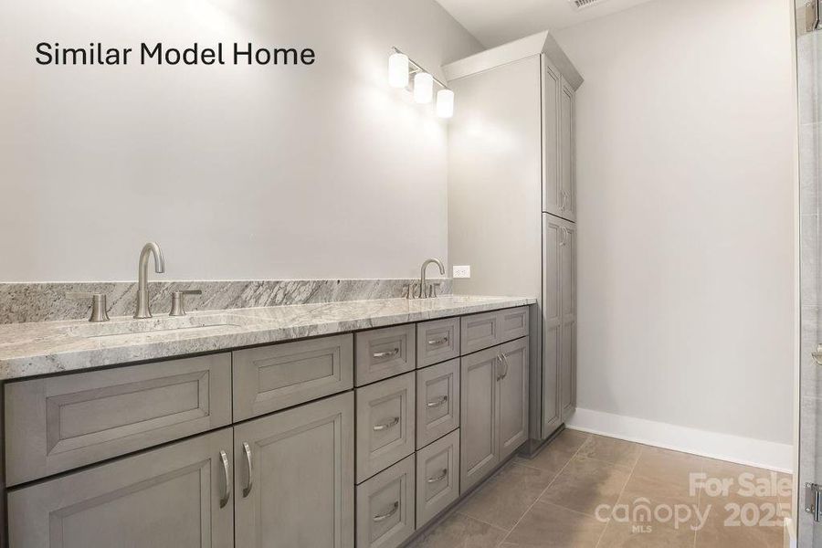 Primary Ensuite bath with dual sinks and plenty of storage Primary Ensuite bath with dual sinks and plenty of storage