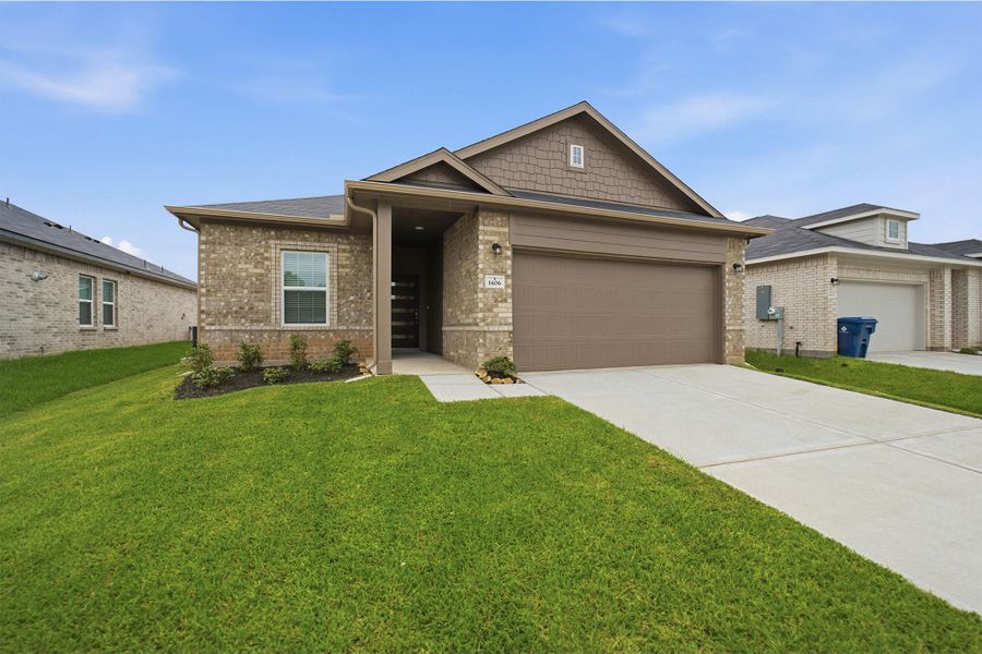Front exterior of a new home in Steed Landing, Texas City, TX, highlighting curb appeal (Image 1). Front exterior of a new home in Steed Landing, Texas City, TX, highlighting curb appeal (Image 1).