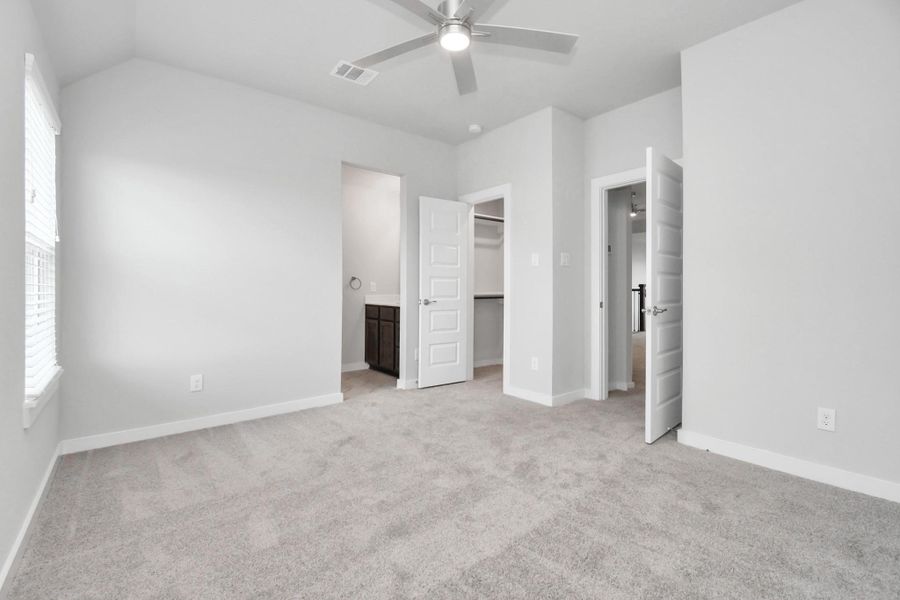 Experience luxury in the generously sized secondary bedrooms, boasting ample closet space, soft and inviting carpeting, large windows welcoming abundant natural light, and the added privacy of blinds for your personal retreat. The indulgence continues with a Jack and Jill bathroom, seamlessly connecting and enhancing the convenience of these living spaces. Sample photo of completed home with similar floor plan. Actual colors and selections may vary. Experience luxury in the generously sized secondary bedrooms, boasting ample closet space, soft and inviting carpeting, large windows welcoming abundant natural light, and the added privacy of blinds for your personal retreat. The indulgence continues with a Jack and Jill bathroom, seamlessly connecting and enhancing the convenience of these living spaces. Sample photo of completed home with similar floor plan. Actual colors and selections may vary.