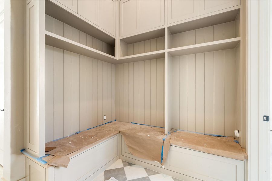 Entry foyer features a custom built mud bench. Entry foyer features a custom built mud bench.