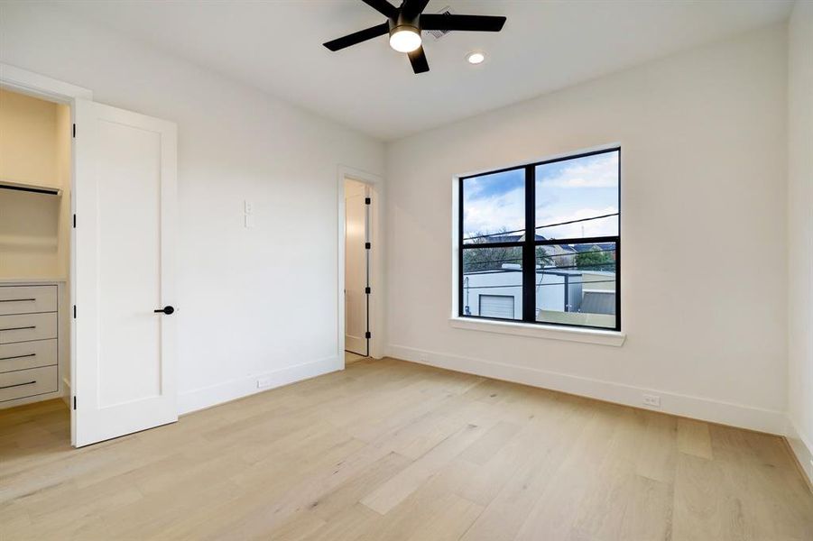 Third bedroom with walk in closet and private bathroom.