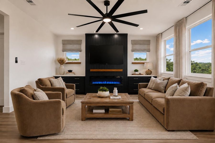 *Virtually staged. An inviting gathering space features an elegant fireplace and abundant natural illumination, perfect for relaxation. *Virtually staged. An inviting gathering space features an elegant fireplace and abundant natural illumination, perfect for relaxation.