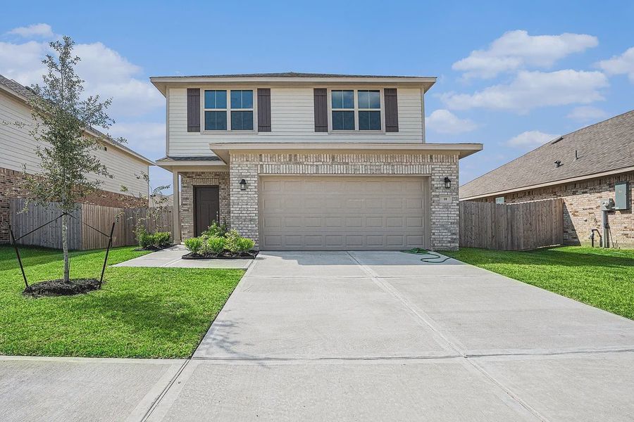 Front exterior of a new home in Kiber Reserve, Angleton, TX, highlighting curb appeal (Image 1). Front exterior of a new home in Kiber Reserve, Angleton, TX, highlighting curb appeal (Image 1).