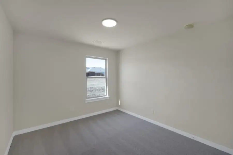 Representative unfurnished interior of a home built from the The Amherst by Lillian Custom Homes in Freeman Farm, Kaufman (Image 49).