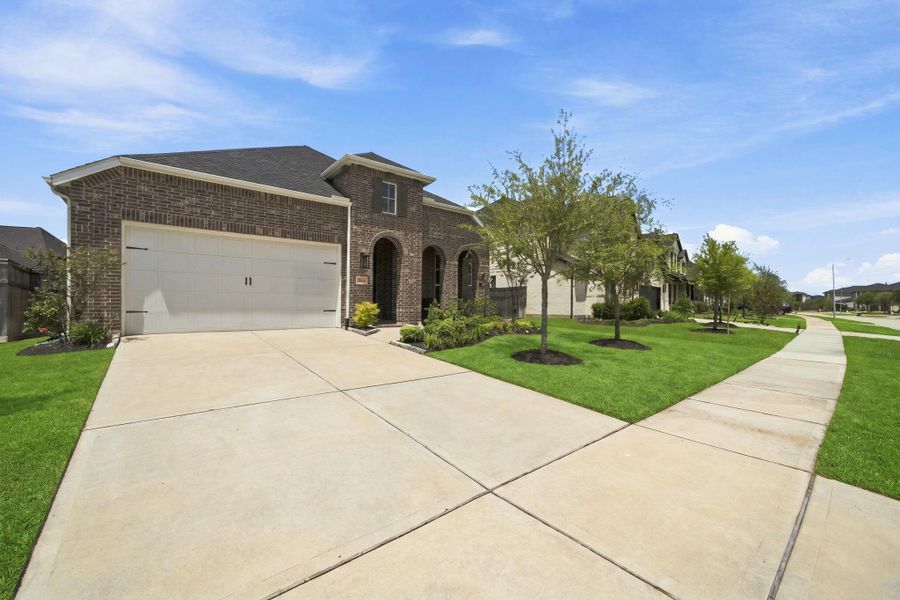 Front exterior of a new home in , Fulshear, TX, highlighting curb appeal (Image 23). Front exterior of a new home in , Fulshear, TX, highlighting curb appeal (Image 23).