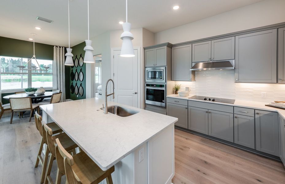 Representative furnished interior of a home built from the Mystique by DiVosta in Emerson Oaks, Vero Beach (Image 14).
