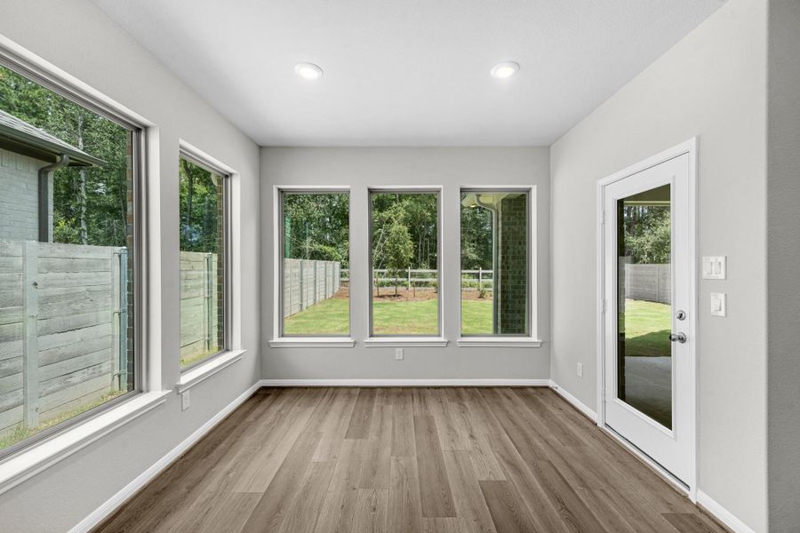 Additional view of the casual dining/breakfast area with access to the covered back patio.