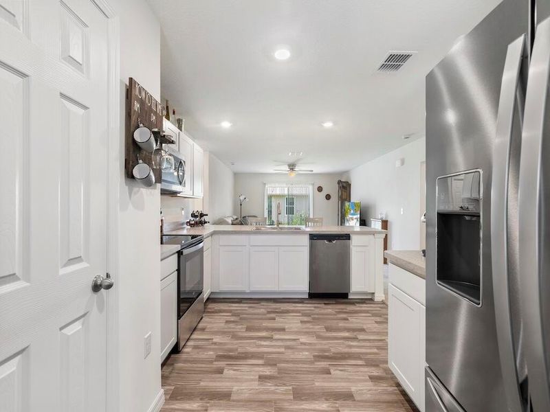 Furnished interior view inside a new home in , Port St. Lucie (Image 11).