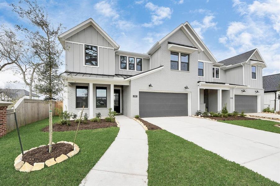 Front exterior of a new home in Sienna: Signature Series, Missouri City, TX, highlighting curb appeal (Image 23). Front exterior of a new home in Sienna: Signature Series, Missouri City, TX, highlighting curb appeal (Image 23).