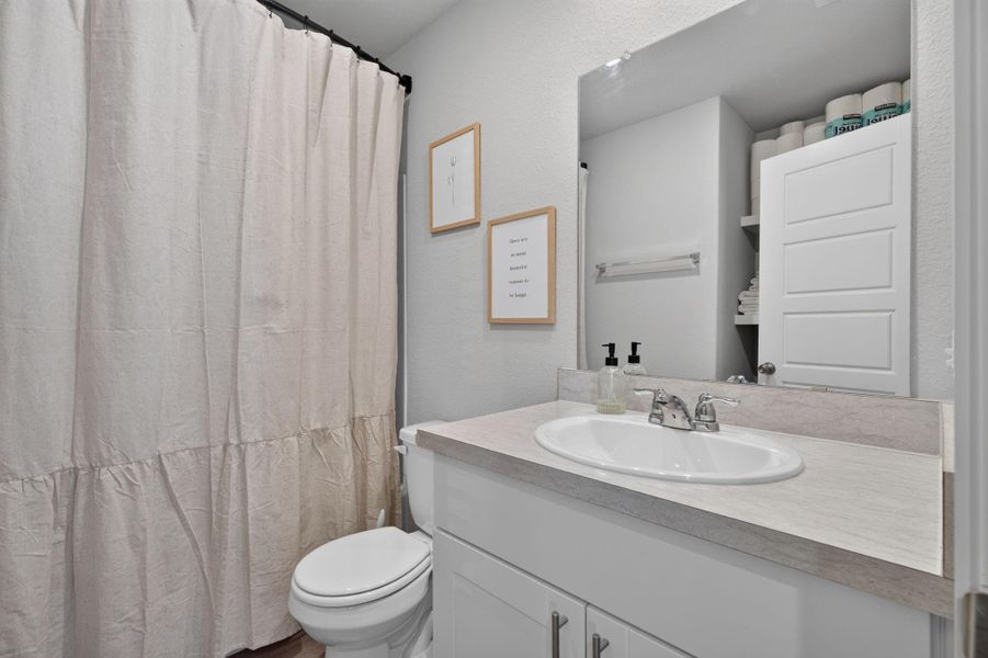 Furnished interior view inside a new home in Caney Mills, Conroe (Image 11).