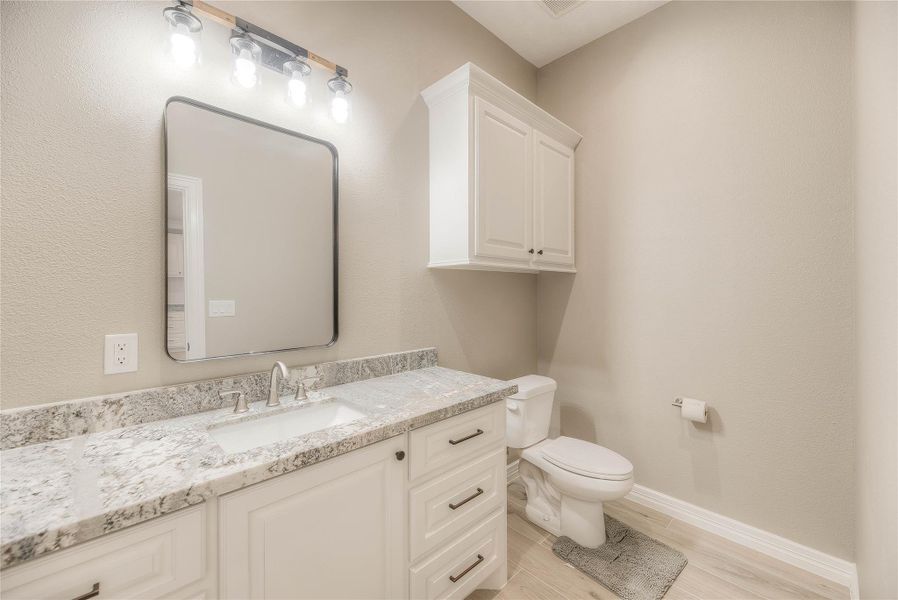 Half bathroom next to kitchen Half bathroom next to kitchen