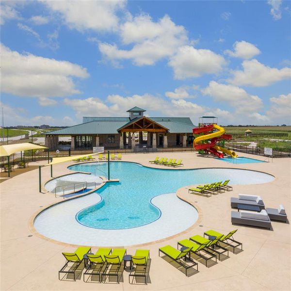 View of pool with a patio and a water slide